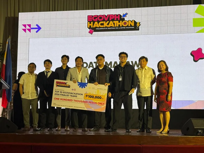 Our team on stage at the eGovPH Hackathon 2026, holding a ₱100,000 check
